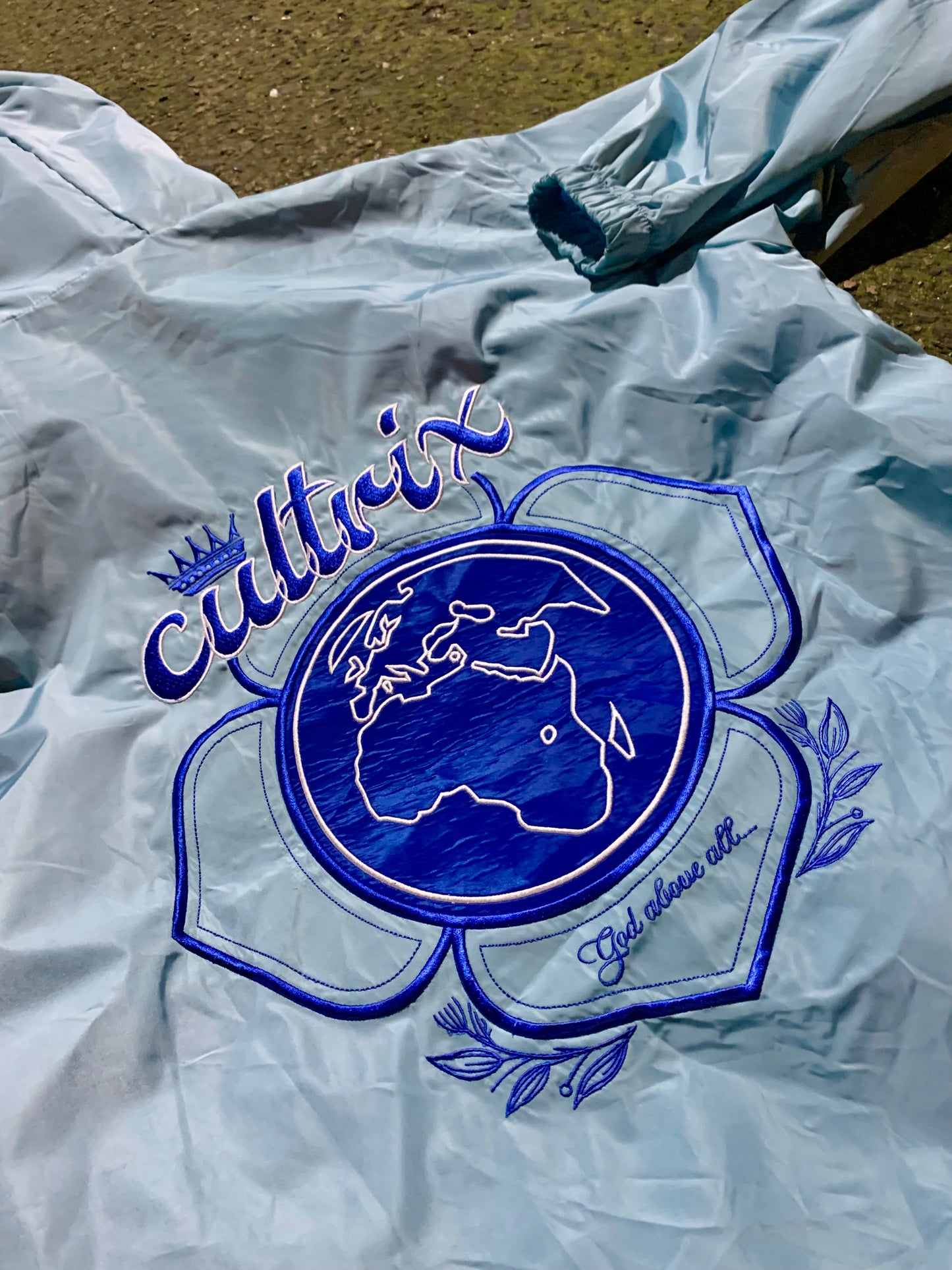 Light Blue "God Above All" Cultrix Windbreaker